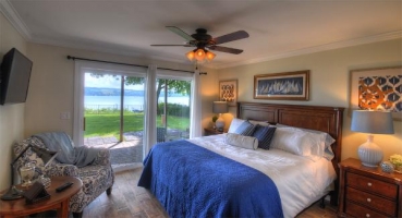 Master bedroom with king bed and stunning lake views