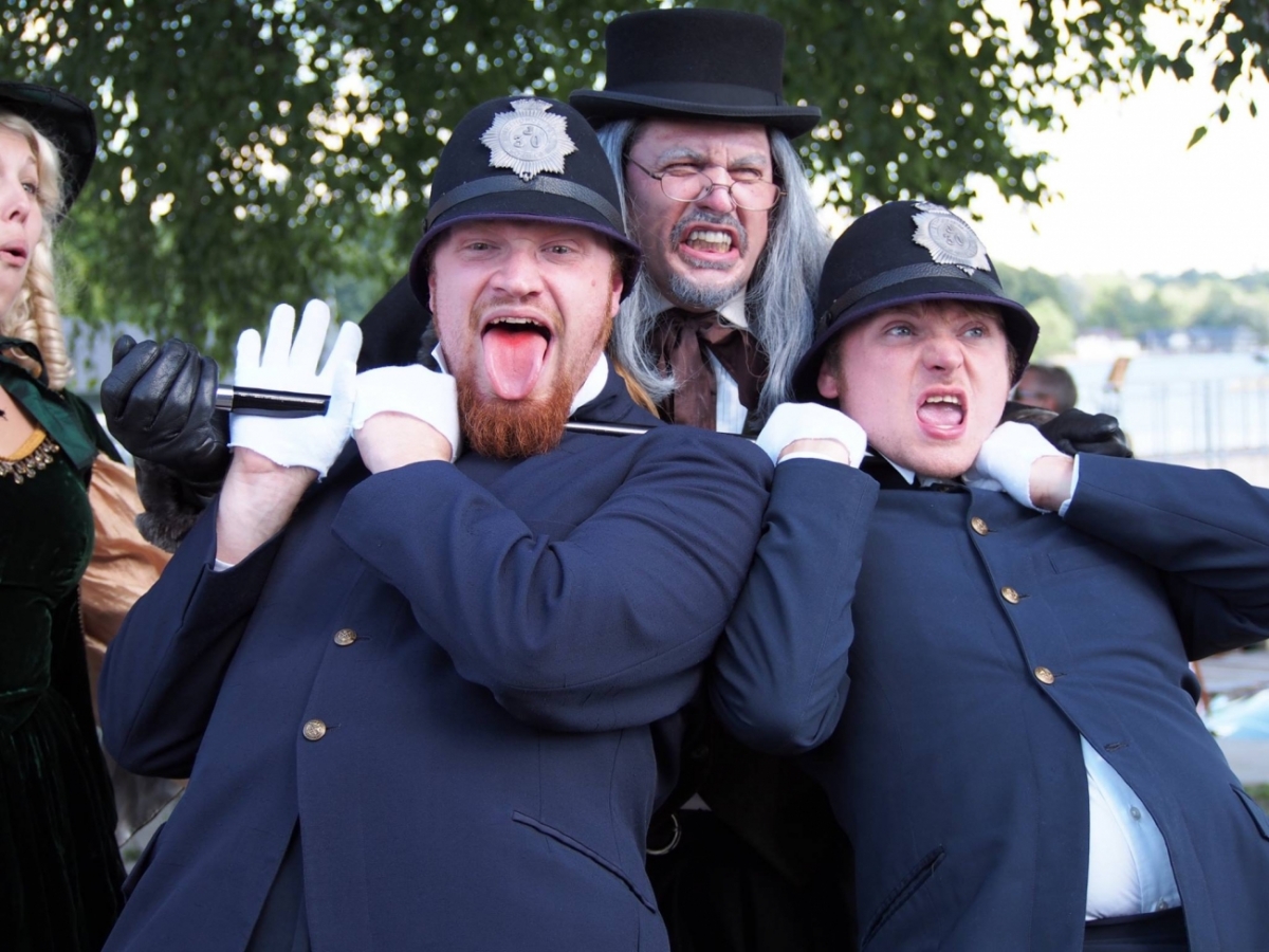 Ebenezer Scrooge character with police officers
