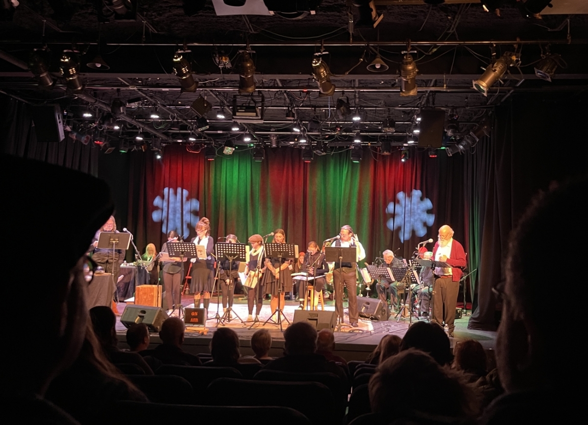 Radio Play Image image of actors on a stage with microphones